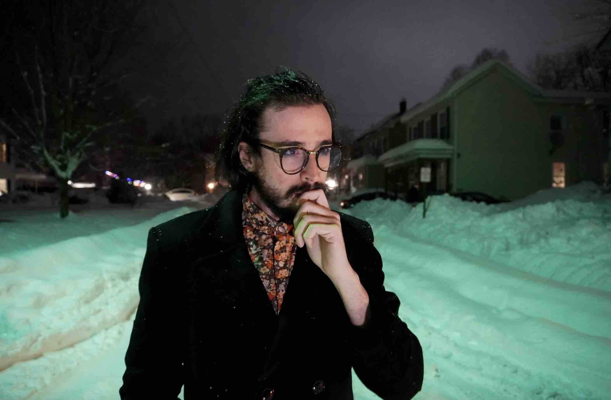 Will Wood standing alone in the snow.'